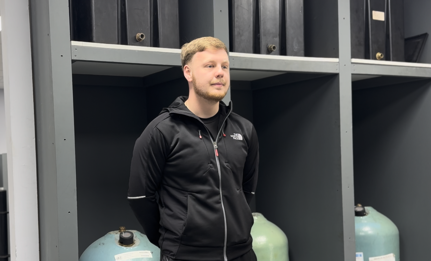 plumbing candidate stood in plumbing workshop