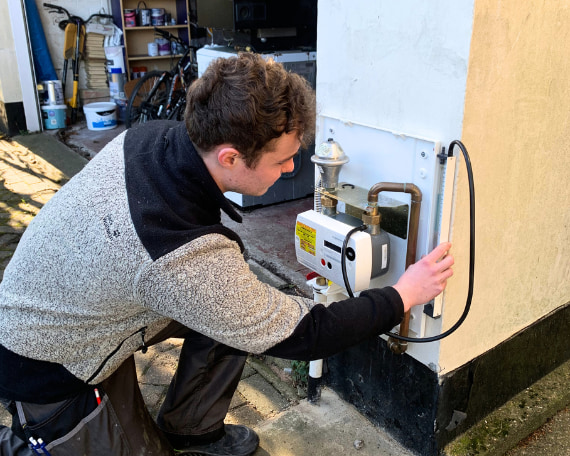 Gas engineer working on a gas meter