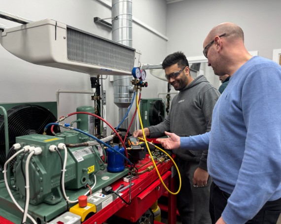 Refrigeration qualifications - 2 f-gas students on a training rig