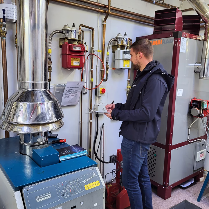 A commercial gas candidate working on a gas meter as part of their commercial upksill package