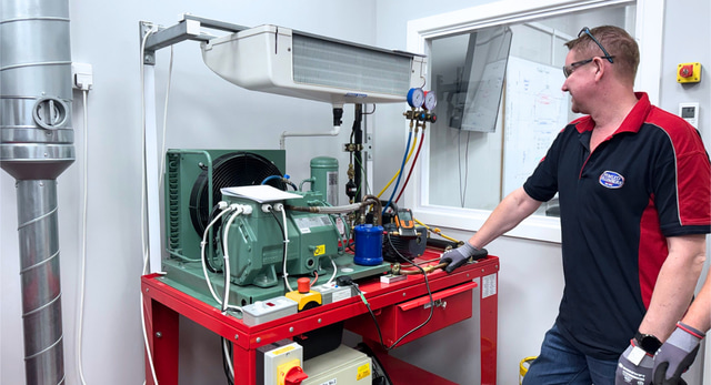 An AC engineer completing their training that falls inline with TM59