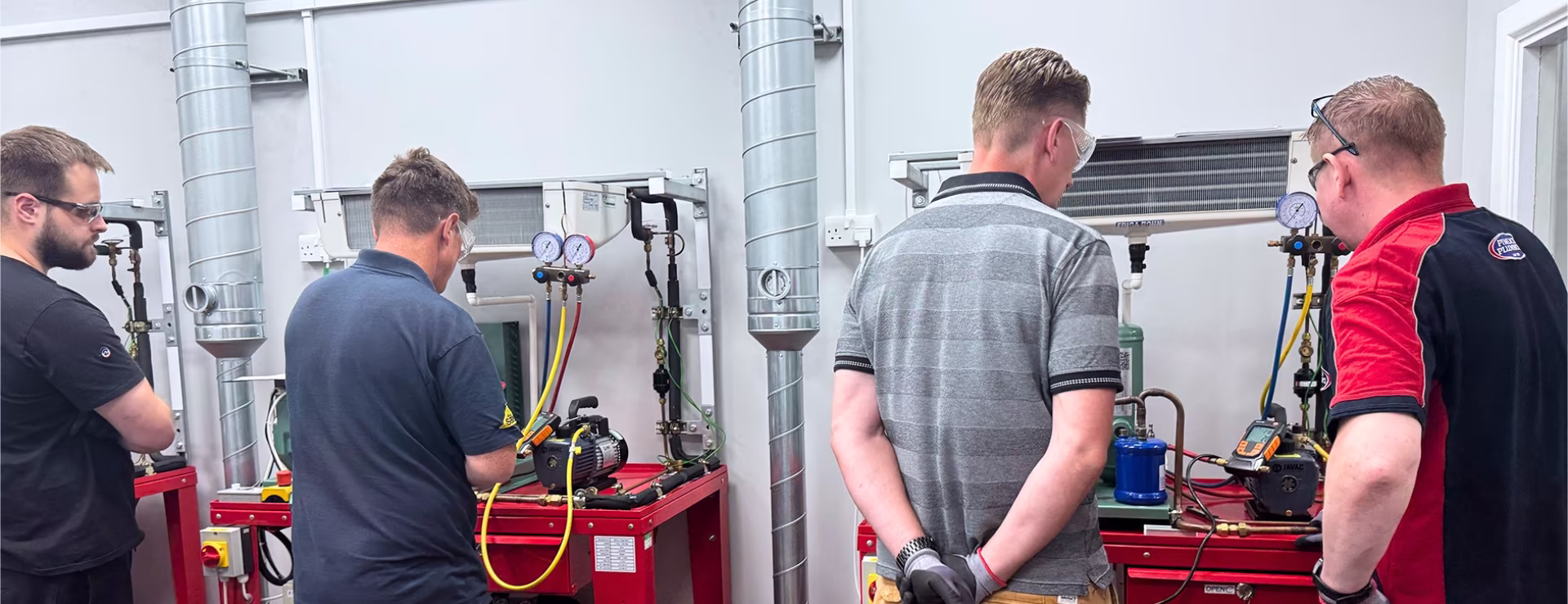 a group of ac engineers completing their refrigeration training that meets TM59
