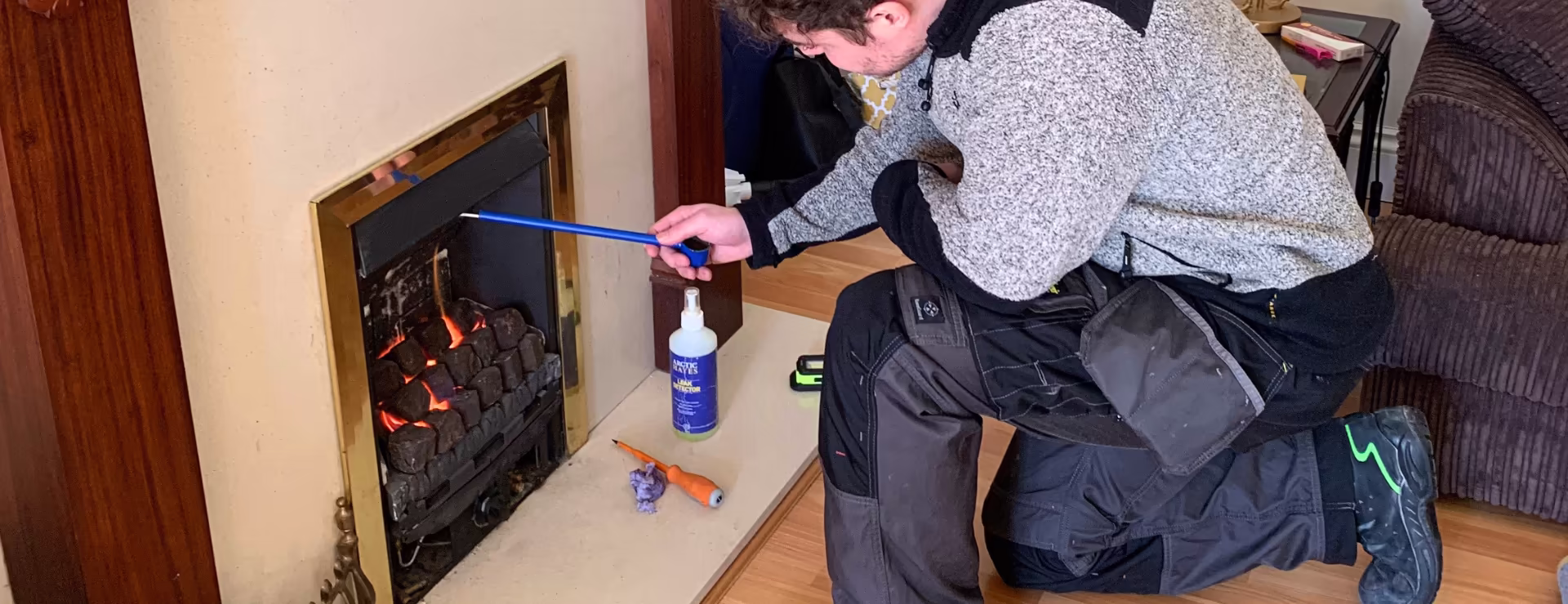A Logic4training gas candidate testing a gas fire as part of their gas portfolio