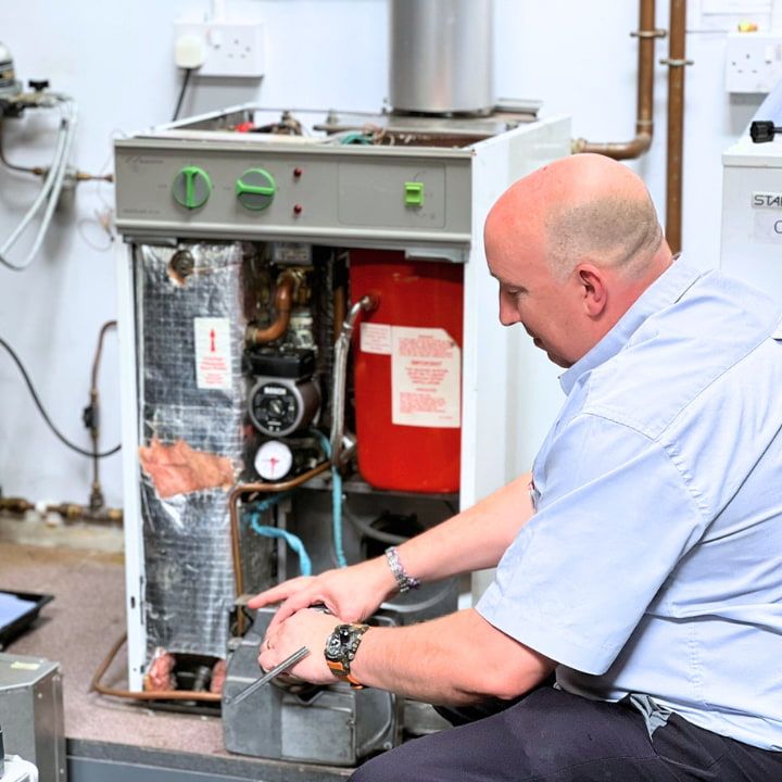 A Logic4training oil trainer demonstrating how to correctly work on an oil appliance