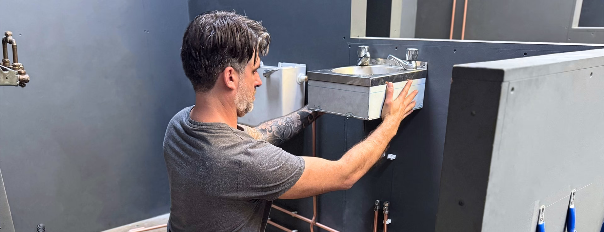 A Logic4training plumbing candidate fitting a sink