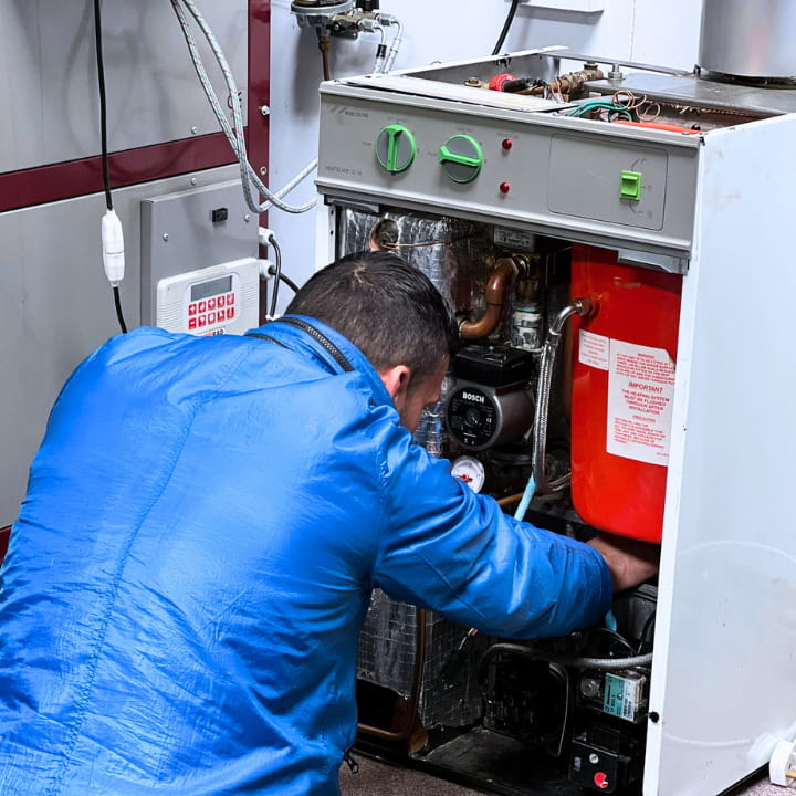A man training on an oil boiler of their OFT50 course