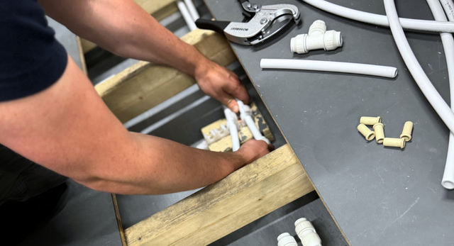 A man training to become a plumber and gain their CSCS and JIB cards