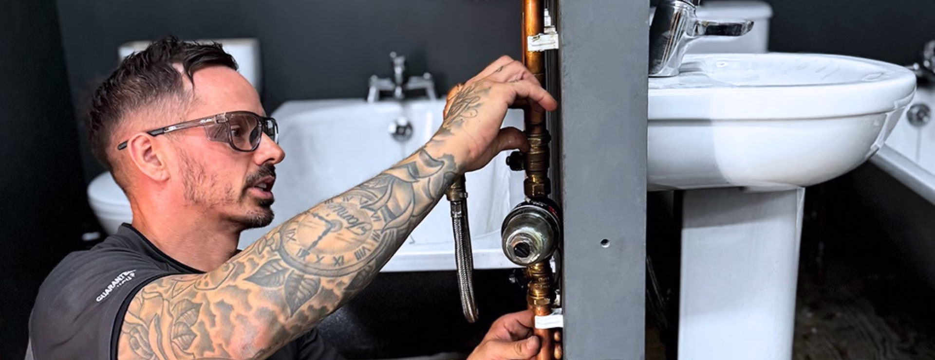 A plumber fitting a mag clean at Logic4training