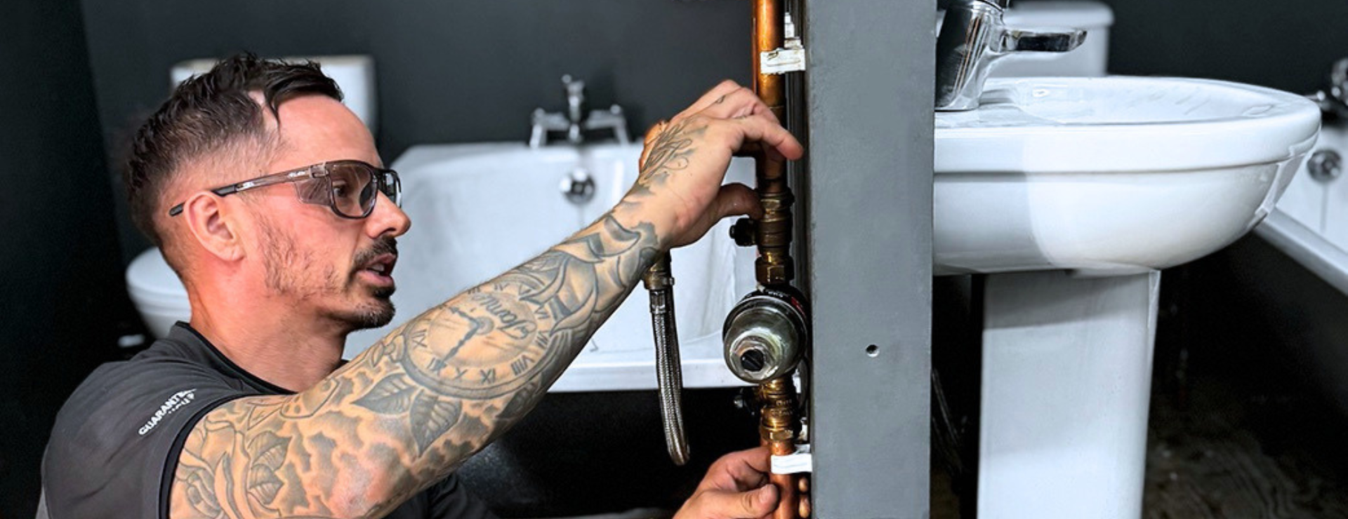 A plumber fitting a mag clean at Logic4training
