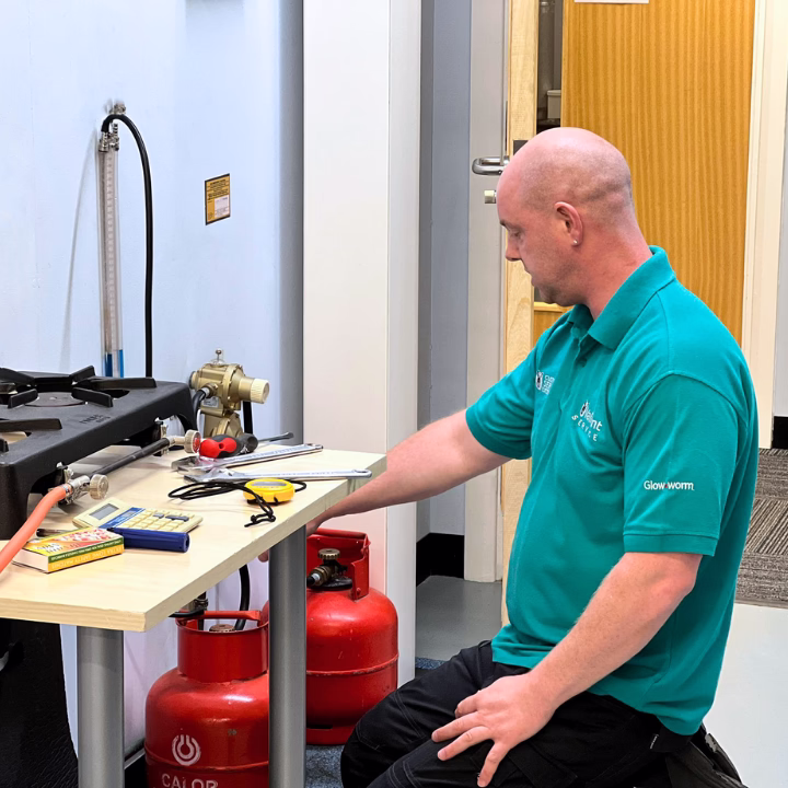 An LPG candidate working on an LPG bottle as part of their training course