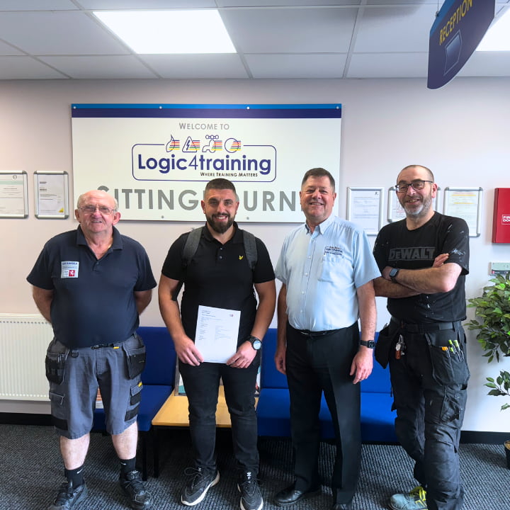 Level 3 Electrical NVQ students with their trainer after completing their course