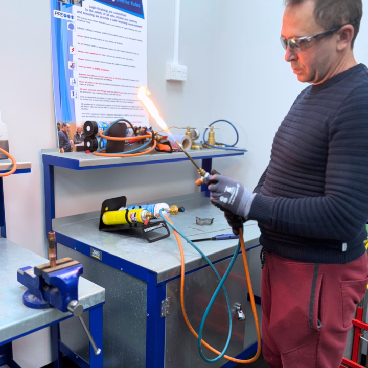 a man learning how to braze on a basic f-gas course