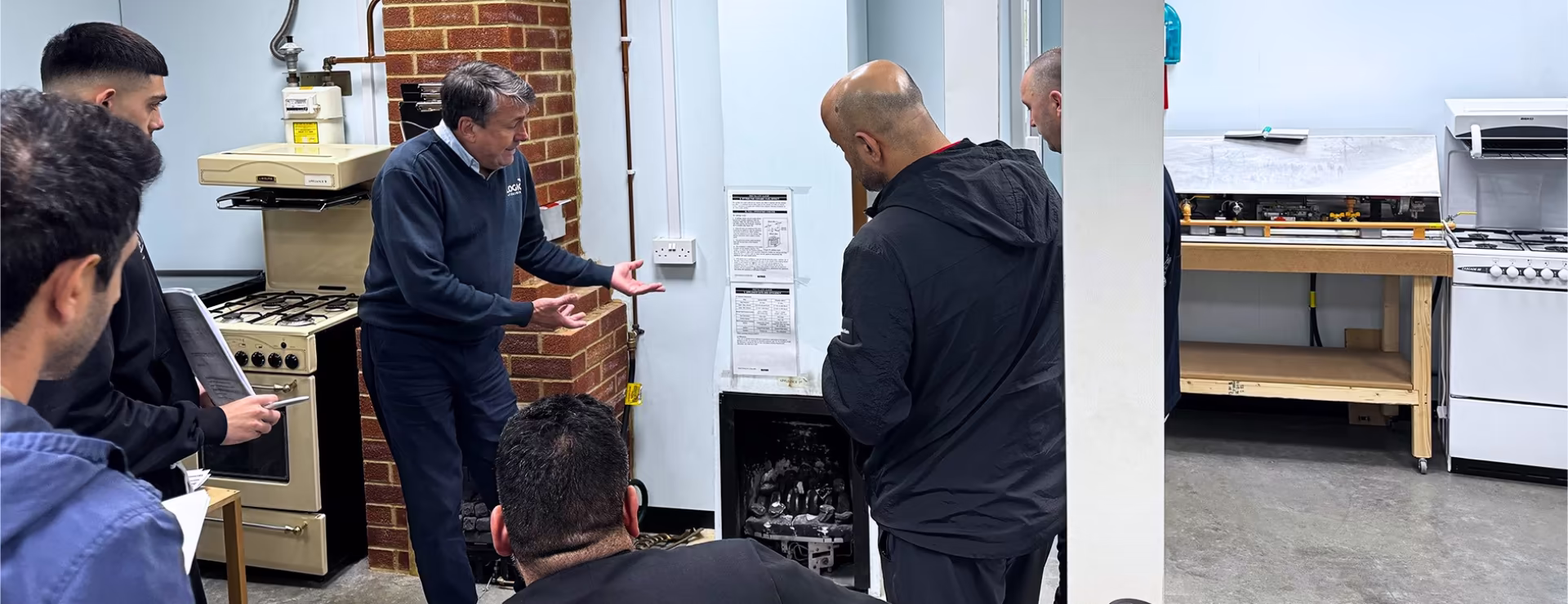 A group of me on their gas course being taught how to work safely on a fireplace