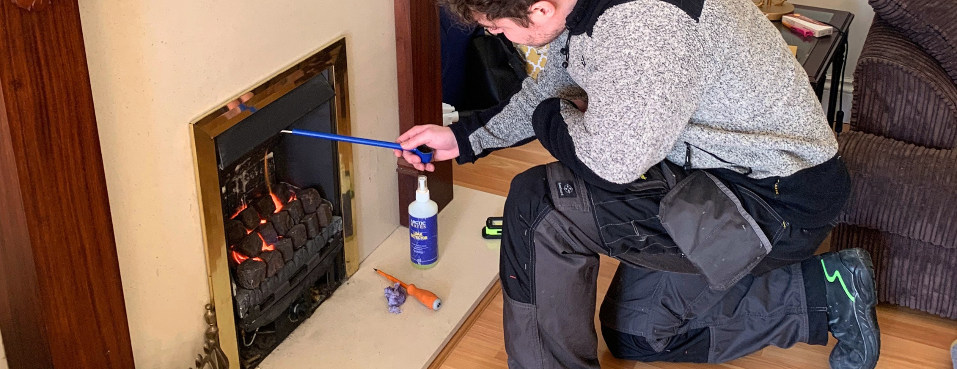 A man working on a gas fire after completing their HTR1 category training