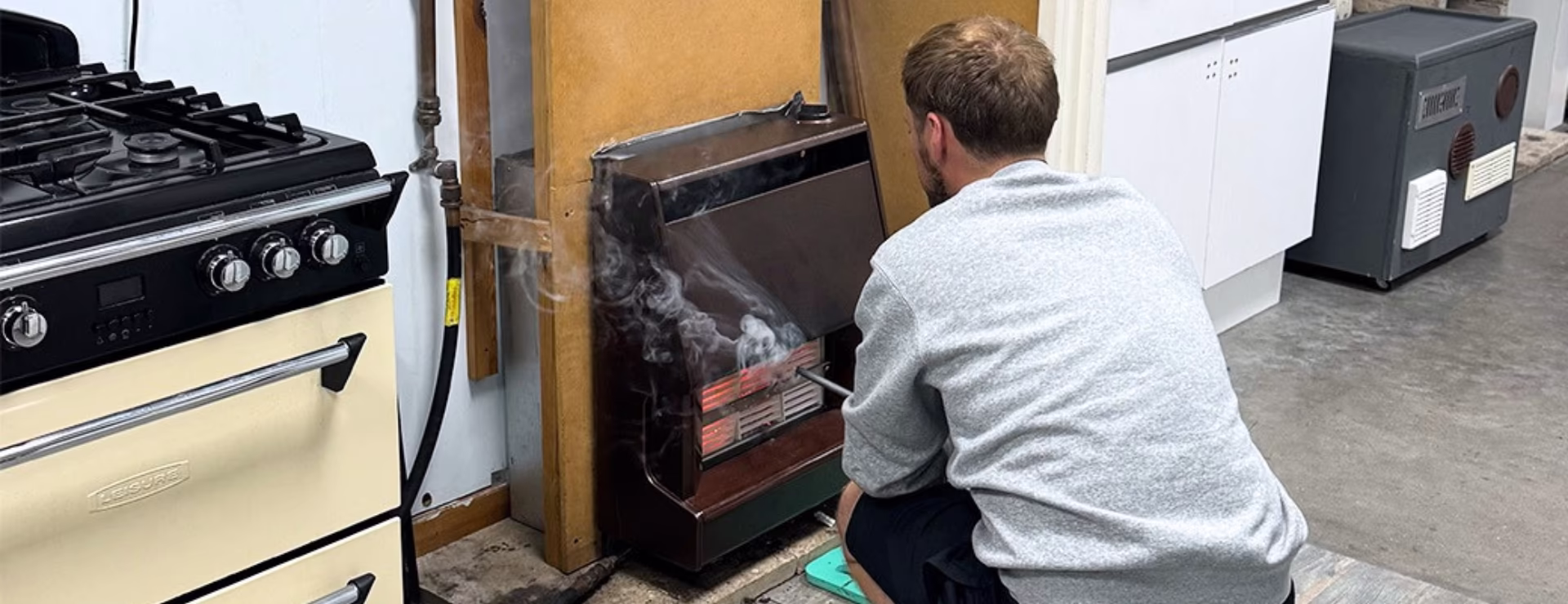 A plumber learning about gas fires as part of their gas course